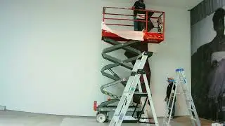 Installing a custom mural of a tree with a scissor lift &ndash; PASWM