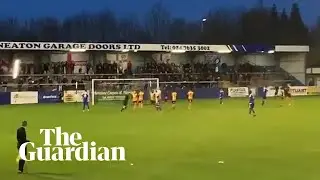 Nuneaton Borough keeper shanks penalty into stands and breaks a light