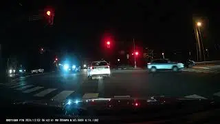 Jack Martin Blvd SUV driver ignores red light almost hitting turning Silver sedan