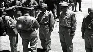 General Henry Arnold pins medals on 58th bombing wing troop's uniform in Tinian I...HD Stock Footage