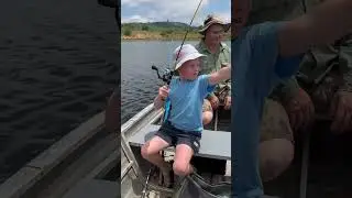 Fishing for bass on a private dam in South Africa. At 6 years old he is getting hooked big time