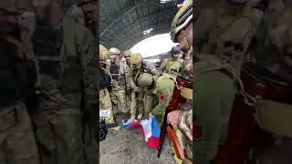 Ukraine soldier walk and burn on russia flag
