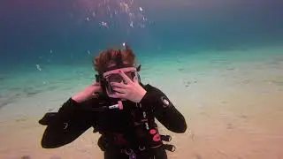 Amanda practicing switching from full face to normal dive mask with OTS Guardian in Bonaire