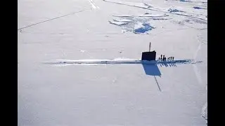 How does a submarine surface through the ice?