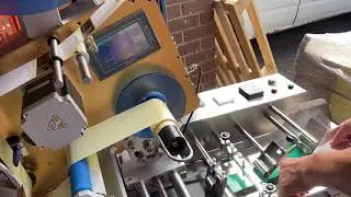 Labelling-solutions plastic bag feeder label applicator carton feeder