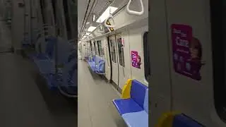 2024 05 09 Singapore empty MRT train at 1pm at Marina Bay station brown line
