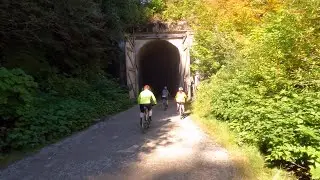 Mountain biking through a 2 mile long tunnel on the John Wayne trail at Snoqualmie Pass  Washington