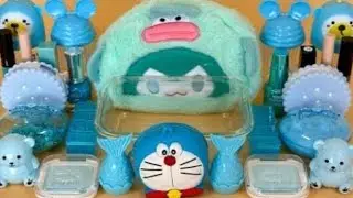 BLUE Doraemon SLIME Mixing makeup 💄 💅 and glitter 🖌️ 🎨 into Clear Slime Satisfying. Slime Video 📸