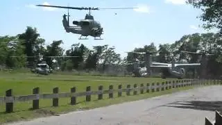 Helicopter rotor wash blasts debris