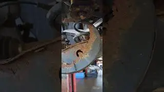 2017 Nissan Murano, backing plate in coil spring