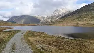 Hiking from Diavolezza to Alp Gr&uuml;m along lake Lago Bianco, Engadin, Switzerland
