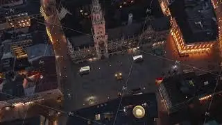 Tilt down revealing famous Marienplatz in Munich, Germany at Night from Aerial perspective