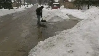 People work quickly to clear standing water, avoid ponding