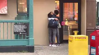 Teenage couple glue together at a local Dunkin&rsquo; Donuts in Manhattan Bronx location