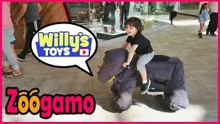 Kid Riding a Zoogamo Pet Buddies Electric Rhino Animal Around the Mall - Willy's Toys