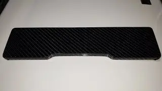 Bamboo wrist rest wrapped in carbon fiber vinyl. 