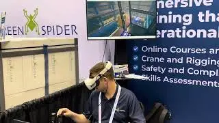 Guy Operating a Cab Crane Using Virtual Reality at the 2025 Promat Show in Chicago