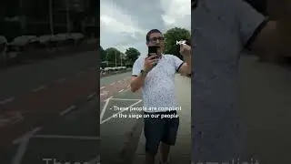 Activists lock the gates of the Jordanian embassy in the Netherlands to protest Gaza siege