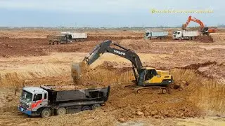 Volvo EC250DL Excavator Digging Loading Dump Trucks. Dump Truck Slip Fail.