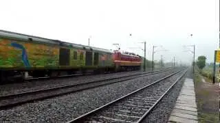 Trains and Rains Ex WAP-6 accelerates with Pune-Howrah LHB Duronto!