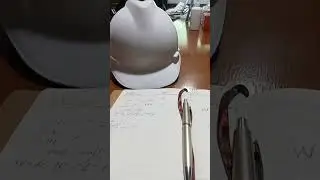 Dad is in a meeting wearing a white safety helmet.