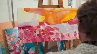 The Joy of Creation: A Man Painting on Canvas in His Studio