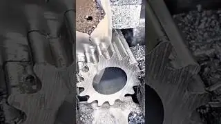 manufactures a metal gear using a specialized machine with coolant for industrial precision