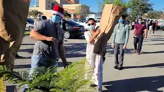 Homestead Hospital employees receive an early holiday gift from a local grower