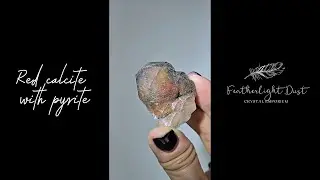 Red calcite dodecahedron with pyrite - CAL88