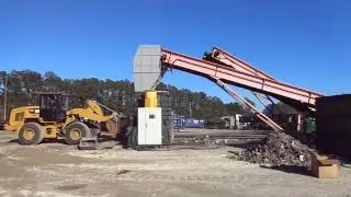 METAL SHREDDING SYSTEM WITH SLOW SPEED SHREDDER AND VERTICAL SHREDDER