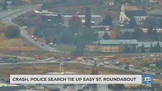 Crash, police search tie up Easy St. roundabout