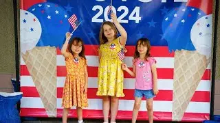 Henderson children choose between vanilla, cookies and cream as a mock election