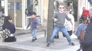 The 2 red eds performing on church street liverpool and starring the dancing kids