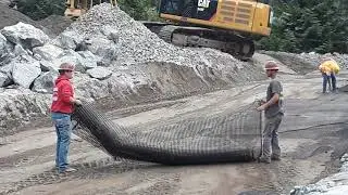 Building a huge rock wall (C. & C. EDWARDS CONSTRUCTION) Kennewick, WA.