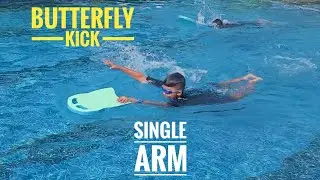 Two students do butterfly kick with board 50m without fin