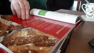ASMR page squeezing a book with thick glossy paper
