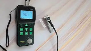 Ultrasonic Thickness Gauge Industrial-888 Measuring the Test Block through the Coating in Echo Mode