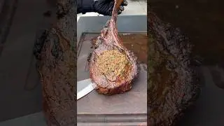 Smoked tomahawk steak with bacon and herb compound butter