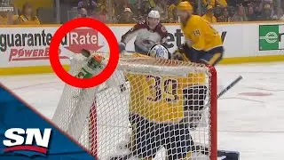 Burakovsky Scores One Of The STRANGEST Goals You'll Ever See By Shooting Puck Through Top Of Net