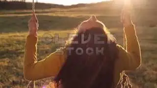 Happiness Concept Young Woman on Swing on Sunset Background HD - Stock Footage