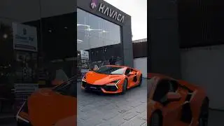 Lamborghini Revuelto a V12 plug-in hybrid supercar.(color-Arancio Apidos)(st.prz.-₹8.89cr in delhi)