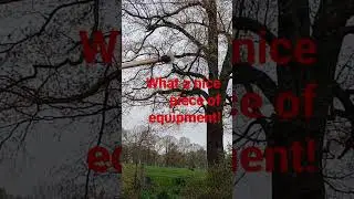 Electric Company trimming trees around the power lines # equipment
