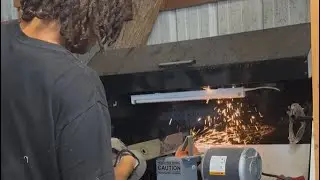 Junior, getting his hands, dirty, sharpening blades and cleaning underneath the deck
