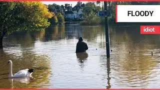 Shocking video show man dangerously wading through waist high flood water after river burst