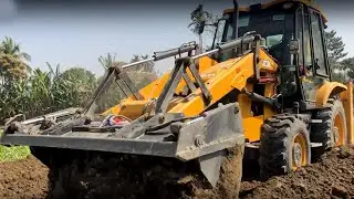 JCB Backhoe Loader Mixing Soil During Construction Of New Road