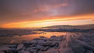 8K Stock Video - Time lapse over ice stacks during beautiful winter sunset at Utah Lake