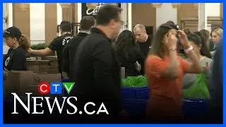 Volunteers gather to package food kits for hungry children across Canada