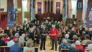Helix Ensemble present Countesthorpe Active Arts with a card to celebrate their 50th Anniversary
