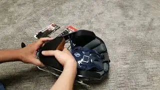 I fix a catcher's helmet chin guard using Velcro.