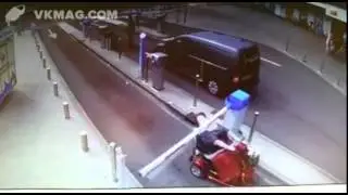 Woman on mobility scooter hitting the boom gate barrier